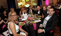 Guests enjoy the auction and video.