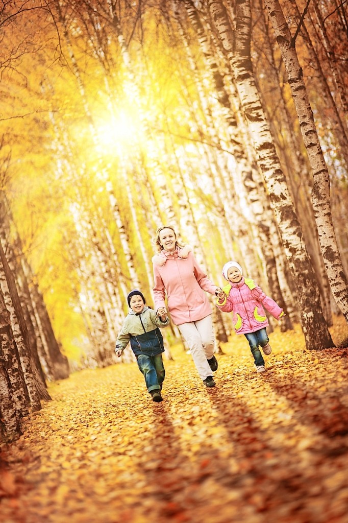 Mother and children in autumn park