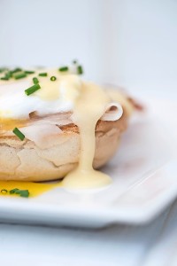 Eggs Benedict toasted English muffins ham poached eggs and holla
