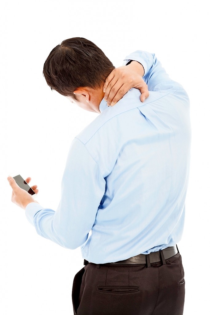 businessman holding a phone and her neck with pain
