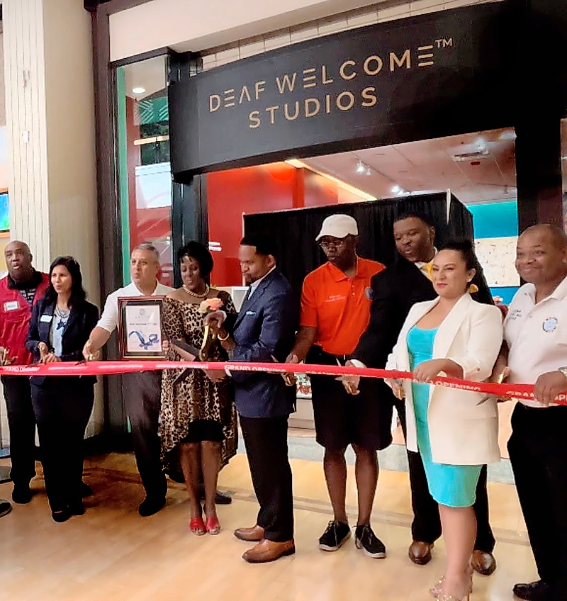July’s opening of Deaf Welcome Studios with founder Theressa DuBois (fourth from left) and Aurora mayor Richard Irvin (fifth from left).