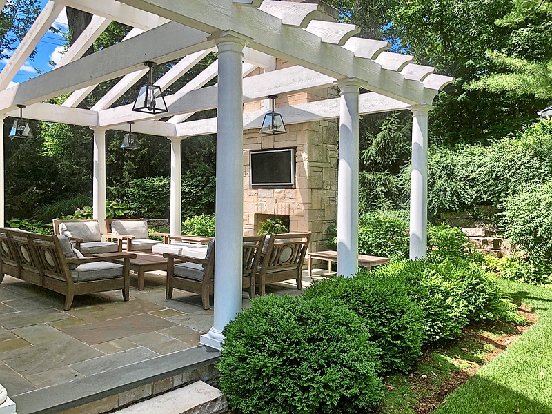 Gatherings moved outside during the pandemic, sparking many homeowners in the western suburbs to invest in outdoor spaces. This pergola and fireplace area was a collaboration between Ray Whalen Builders, architect Dan Marshall, and Western DuPage Landscaping. The open-air structure connects the indoors to outdoors, with natural stone pavers, an outdoor fireplace, and low-maintenance plantings.