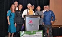 For his smoked pork belly appetizer, chef Scott Willett Jr. (at podium) was crowned winner of the 11th annual Chefs Culinary Challenge February 5 at the Chicago Marriott Naperville.