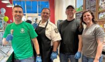 Firefighters (from left) Wes Sewell, Scott Salela, Jim Leslie, and Kelsey Odom scooped free cones April 3 at Ben & Jerry’s to benefit Naperville Firefighters for a Cause.