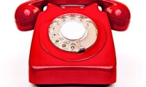 A red rotary telephone