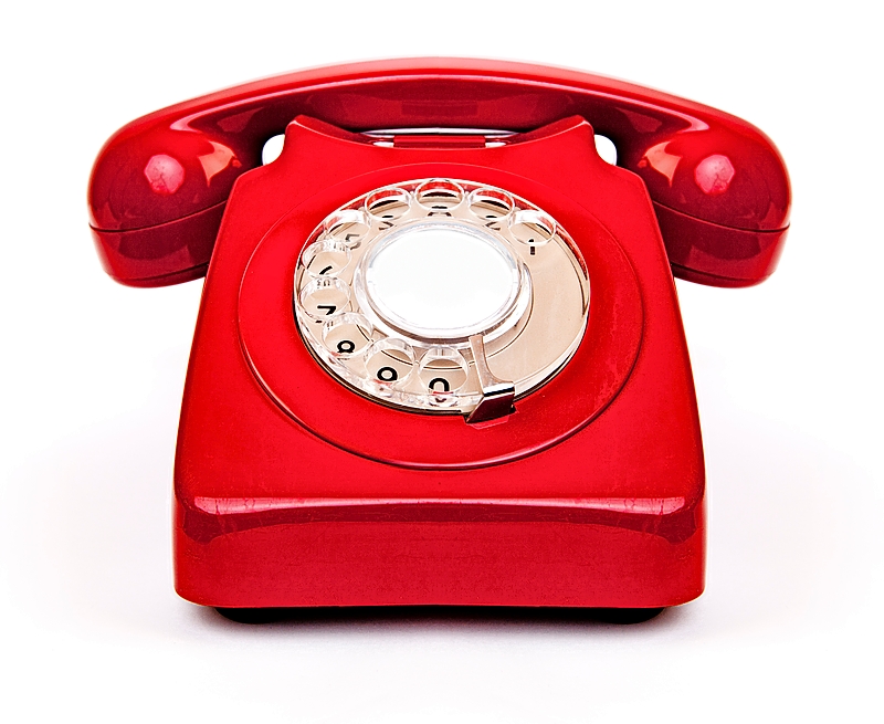 A red rotary telephone