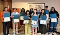 The Edward Foundation awarded $20,000 in scholarships April 20 to 10 Edward Hospital student volunteers, who greet visitors, deliver flowers, transport patients, and assist in other ways.