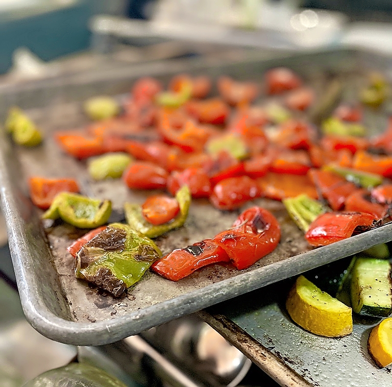 Chopped vegetables on a baking sheet