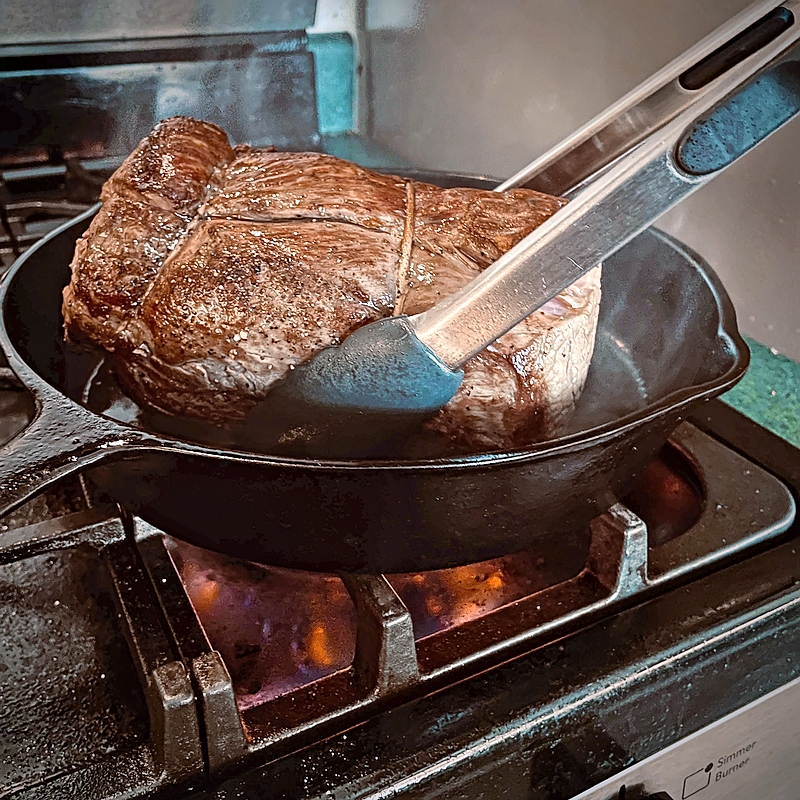 Beef searing in the pan
