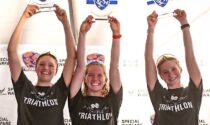 The North Central College women’s triathlon team won the Division III collegiate national championship November 11, defending its crown and claiming its fifth national title in program history. Pictured on the podium in Tempe, Arizona, are (from left) Charlotte Kumler, Hailey Poe, and Bethany Smeed
