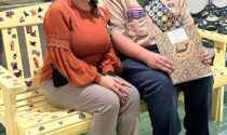 Eagle Scout Troop 202 of Lombard, led by Eagle Scout Noah Munson (right), recently built and donated a bench that features an I-Spy game for pediatric patients at Endeavor Health Edward Hospital in Naperville. Also pictured is Nina Sittler, a certified child life specialist at the hospital.