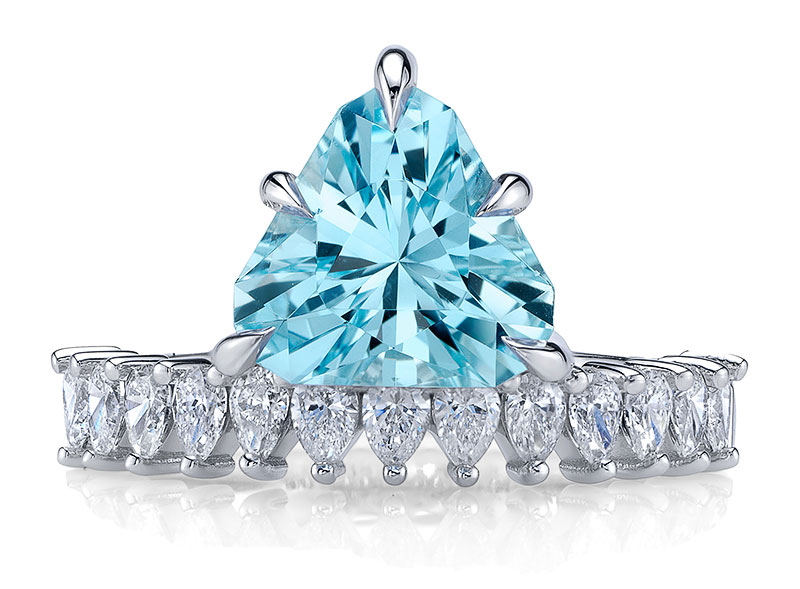 A Marino Agostino custom-designed ring in 18-karat white-gold with a 2.54-carat Brazilian aquamarine untreated in a specialty trillion cut accented with pear-shaped natural diamonds