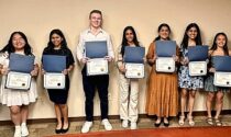 The Edward Foundation awarded $20,000 in scholarships on April 18 to 10 Edward Hospital student volunteers who greet visitors, deliver flowers, transport patients, and assist behind the scenes at the hospital.
