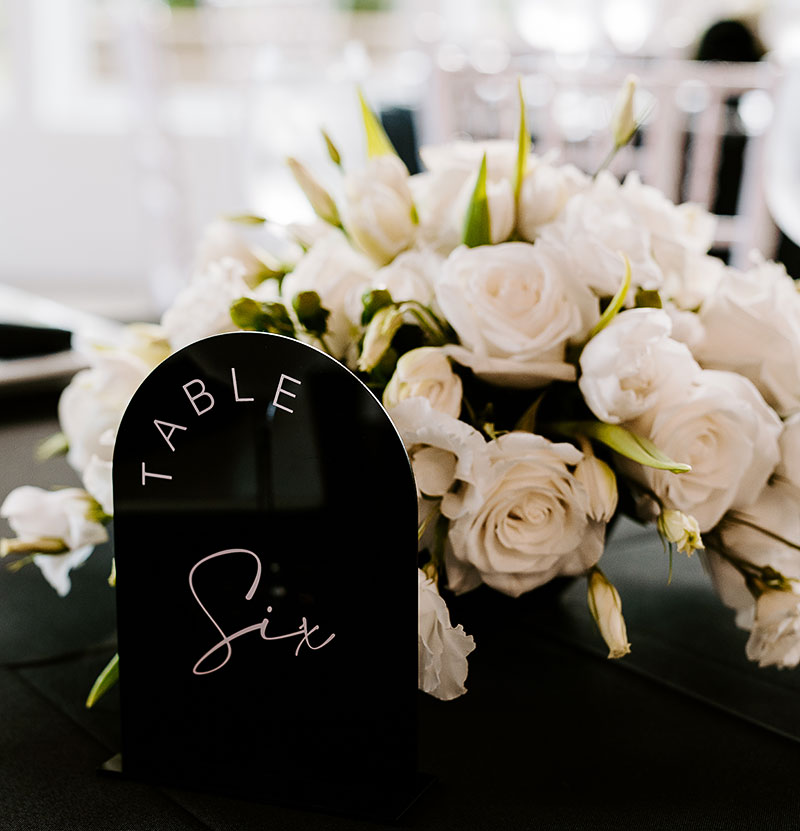 A table decorated with wedding flowers and wedding decorations