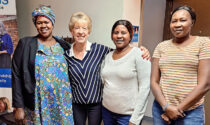 A retired literacy teacher (second from left) leads an English conversation group for refugee women.