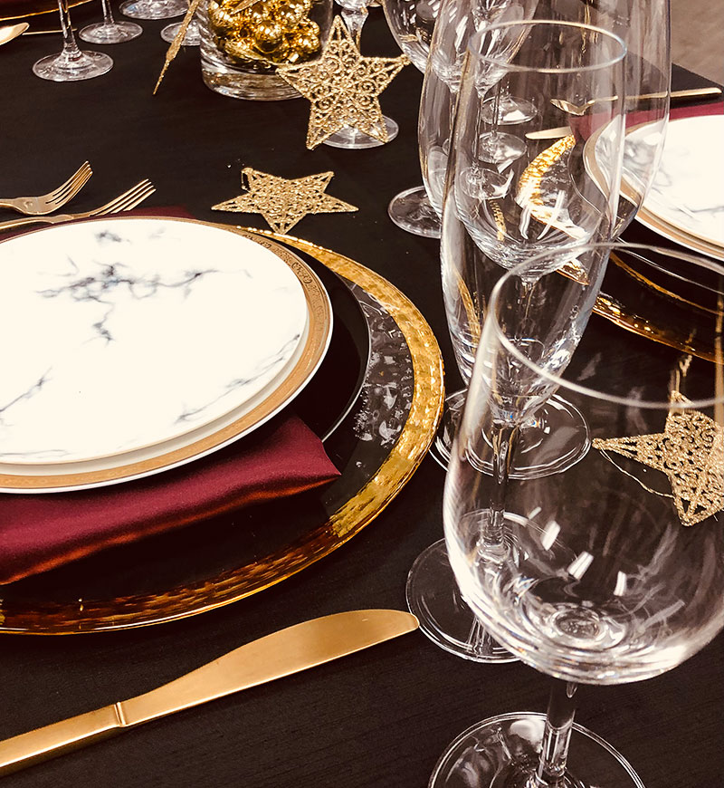 Holiday themed place settings on a table