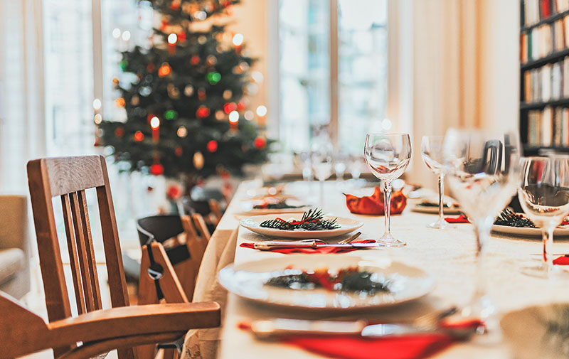 A dining room table decorated for Christmas