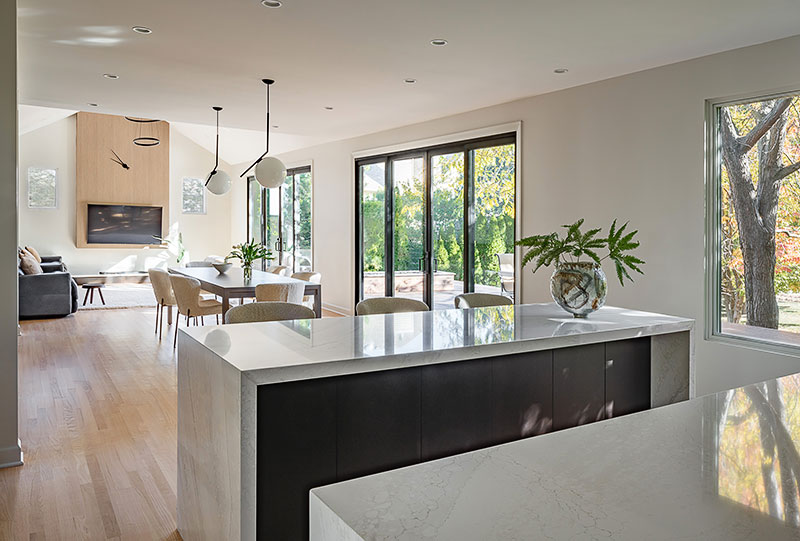 A photo inside the Naperville home from the kitchen, looking into the dining area and the living room