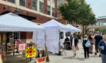 On July 13, the second annual Water Street Fine Art & Fine Craft Fair showcased 18 regional artists who work in painting, ceramics, glass, wood, and digital art. Two artists from the DuPage Children’s Museum (above) created a floral chalk street mural, inviting the fairgoers to collaborate.