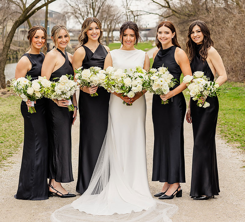 Sophia Davis and her bridesmaids holding bouquets