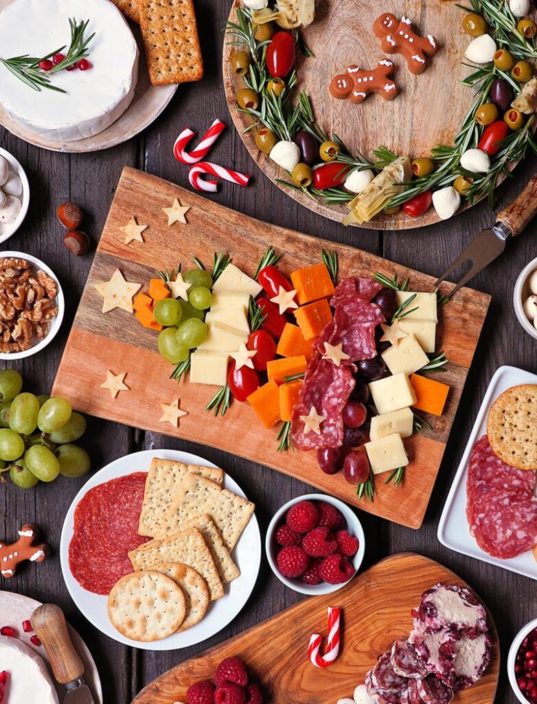 A table filled with various appetizers and a charcuterie board