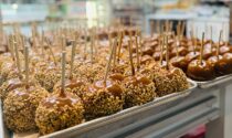 The storefront of Kilwins in downtown Naperville showcases its freshly dipped caramel apples.
