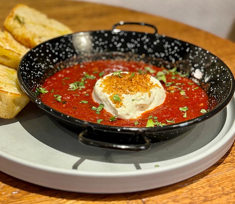 Baked fresh goat’s milk cheese