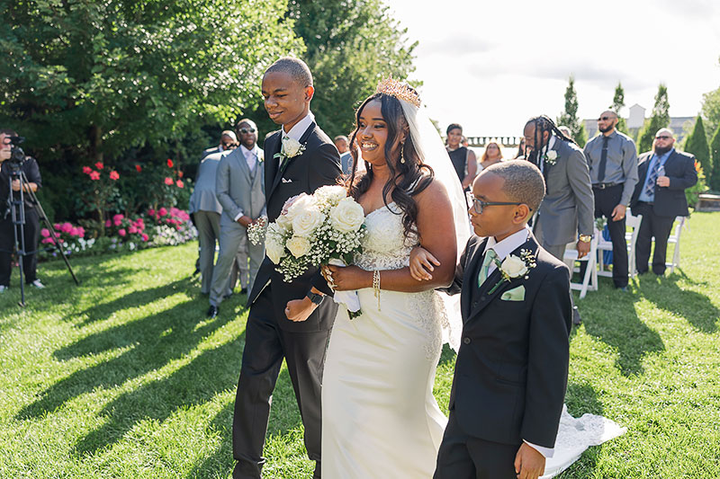 Patrice March-Davidson being escorted down the aisle by her two sons
