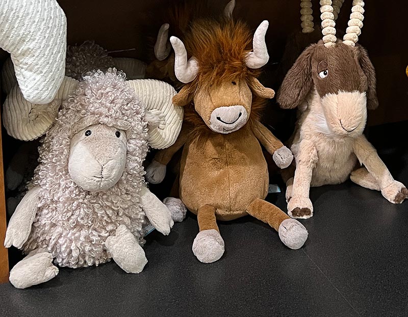 Three animal plushies on a shelf at Fairy Tales