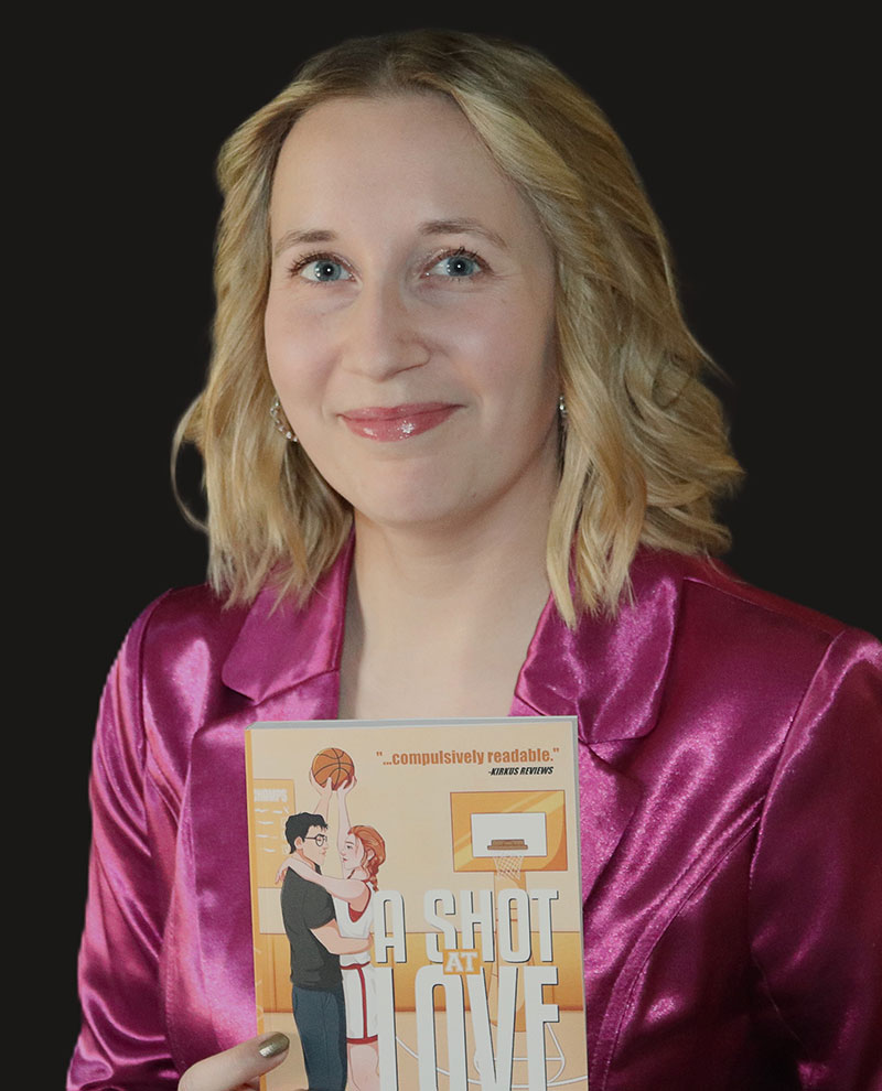 Taylor LaVonne holding her book, ‘A Shot at Love’