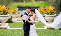 Dana Giragosian and Rob Fortino in wedding attire, embracing in Cantigny Park.