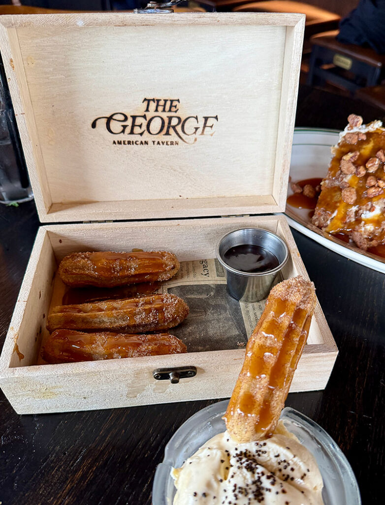 The Cigar Box Churros with ice cream in an ashtray at The George
