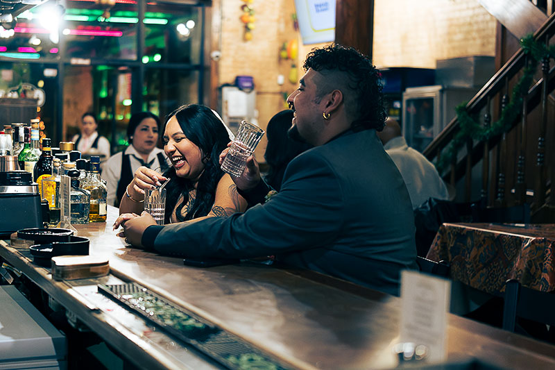 Patrons at the bar at La Quinta de los Reyes