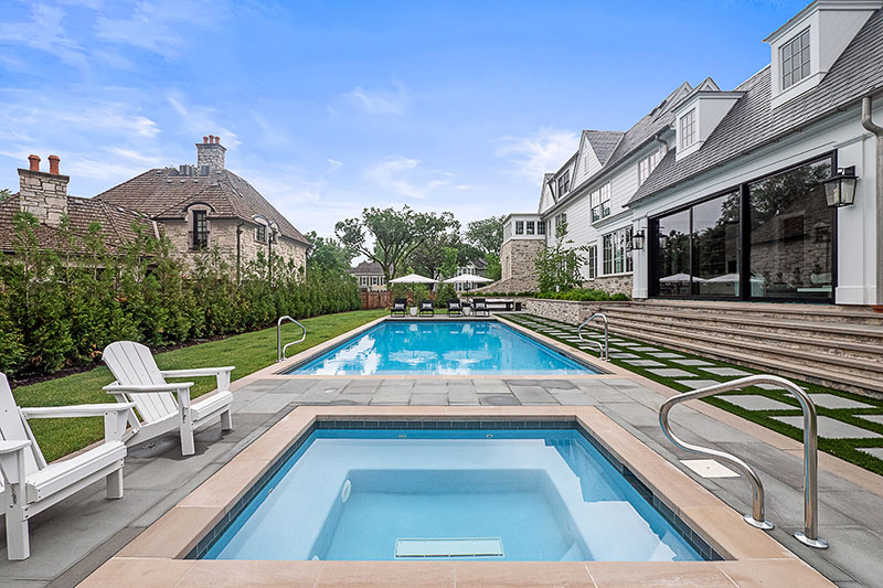 This Hinsdale backyard has a separate pool and spa