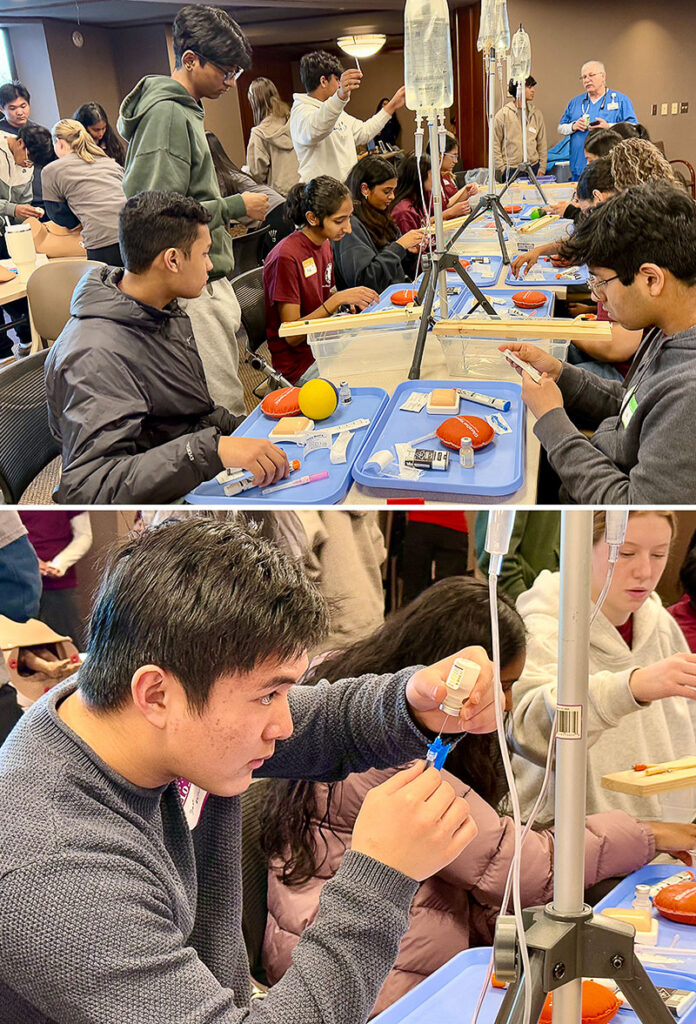 Boys practicing with IVs at Dr. Rubin’s Mini Medical School