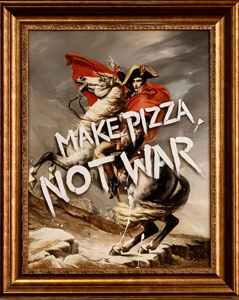 A framed print of ‘Napoleon Crossing the Alps’ by Jacques-Louis David, with "MAKE PIZZA, NOT WAR" written across it