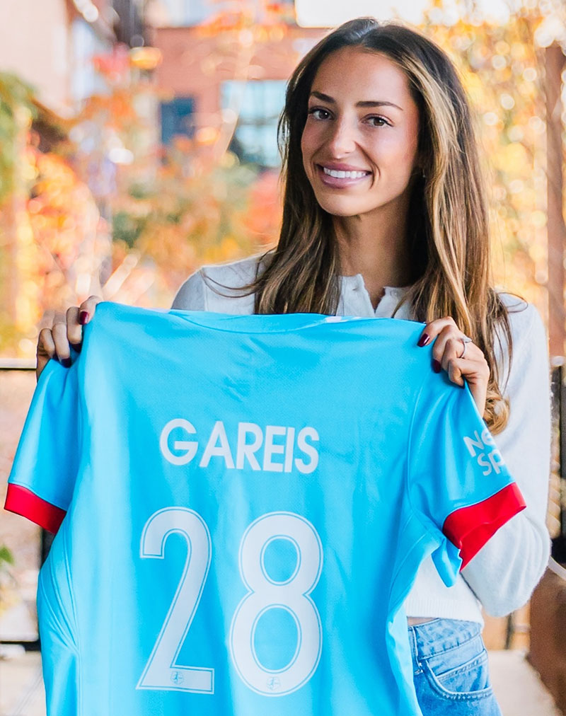Ryan Gareis holding her #28 jersey