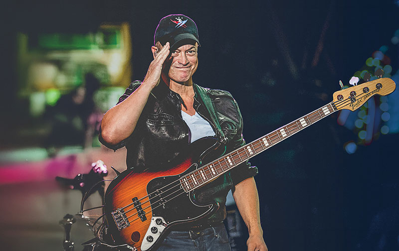 Gary Sinise holding a guitar
