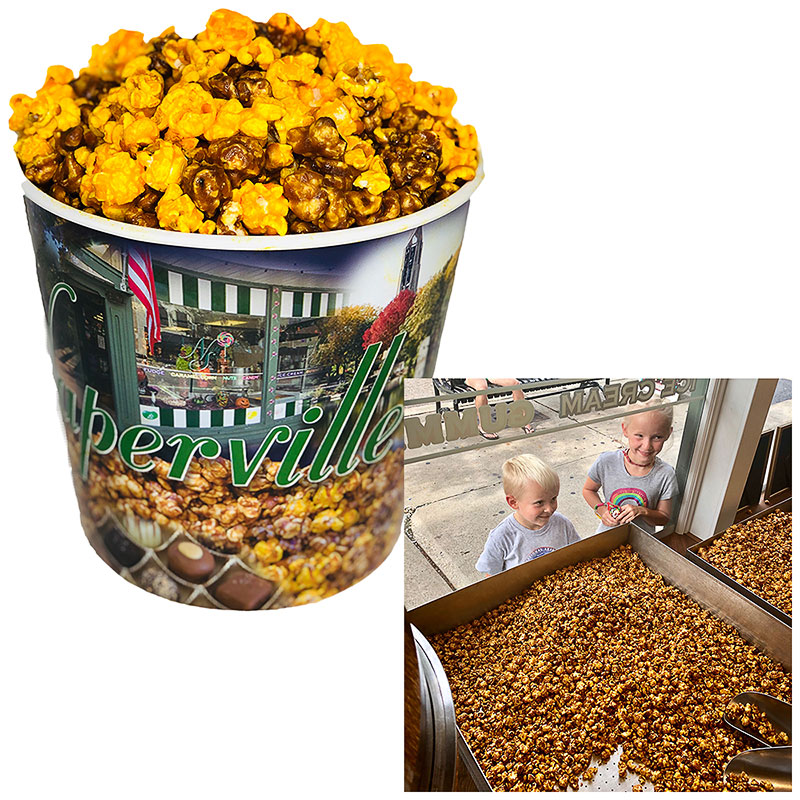 A bucket of cheese and caramel mixed popcorn and kids looking at a bin of caramel popcorn from Naper Nuts and Sweets