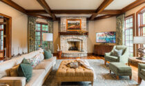 The living room featuring a fireplace in a Geneva home