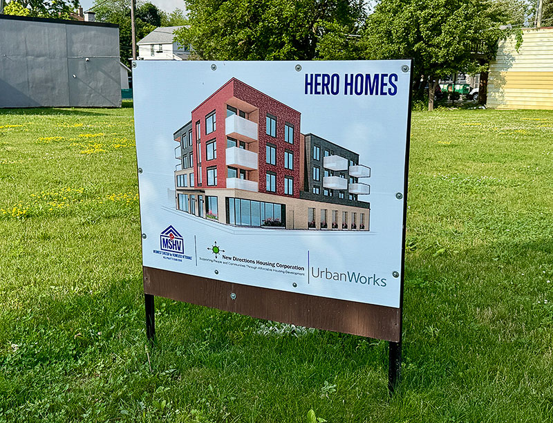 A sign displaying a Hero Homes rendering