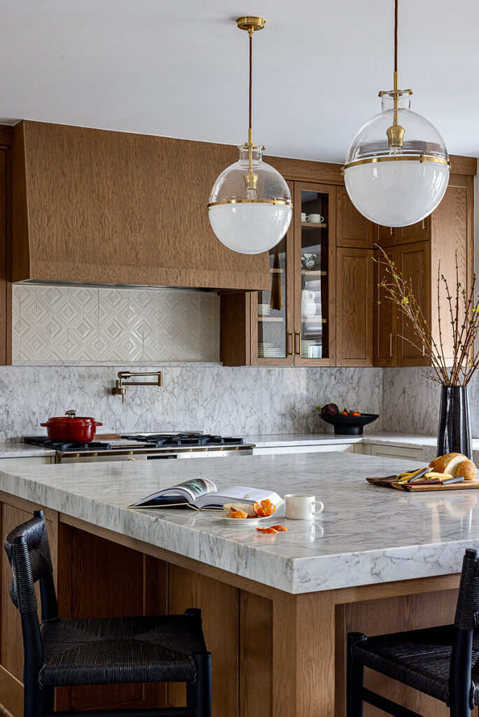 Backsplash, countertop, and island details in the kitchen of the remodeled Lemont home