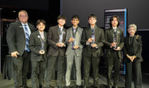 A team from Neuqua Valley High School took home a top prize at the Conrad Challenge in April, a STEM competition hosted by Space Center Houston in honor of astronaut Charles “Pete” Conrad. Team VOCL won the cybertechnology and security category for developing a product called Echo Pulse. The device is designed to help stroke victims communicate by using an LLM-powered headset to decode facial muscle movements into speech in real time. Pictured (from left) are Space Center Houston Chief Learning Officer Daniel Newmyer; VOCL team members Craig De Fiesta, Jayden Chiou, Idhant Ranjan, Atharva Vaze, and James Zhou; and Nancy Conrad, the competition founder and wife of the late astronaut.